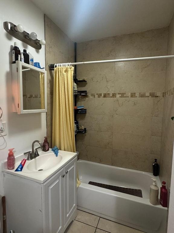 19 6th St, Chelsea, MA 02150 - full bath featuring shower / tub combo, tile patterned flooring, and vanity