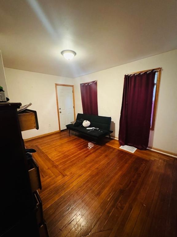 19 6th St, Chelsea, MA 02150 - interior space featuring wood-type flooring and baseboards