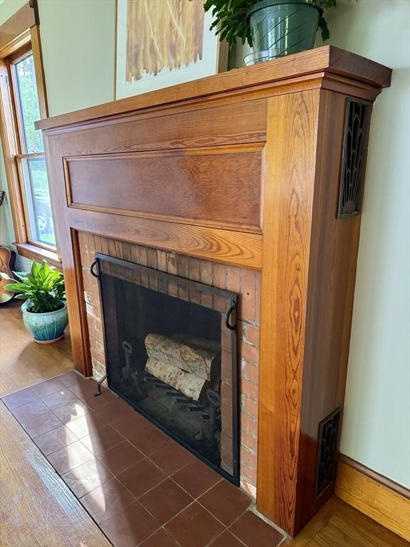 details featuring a brick fireplace