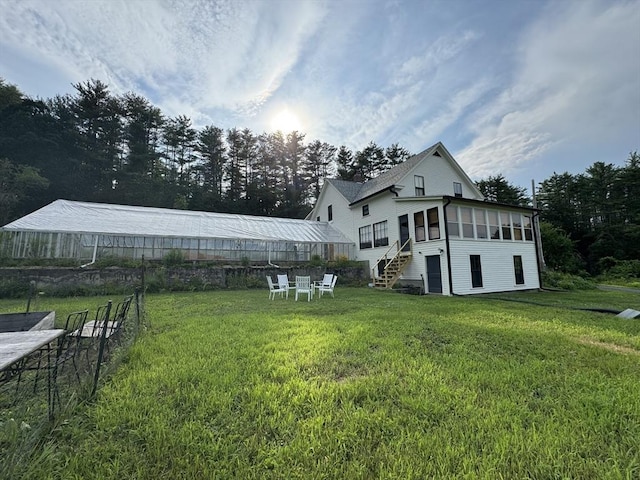 view of yard featuring a sunroom