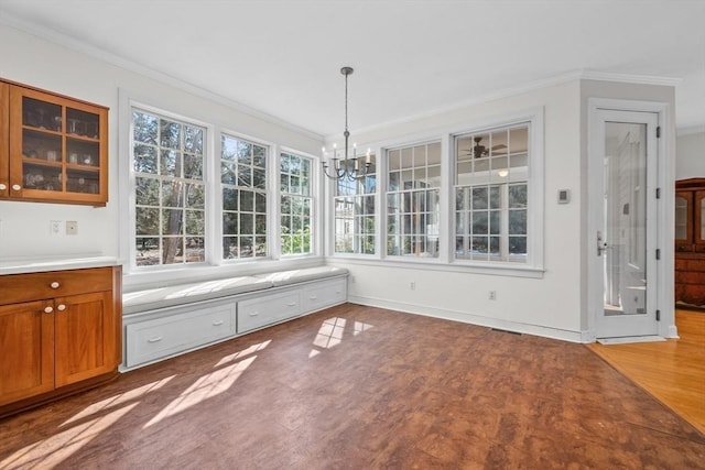 unfurnished dining area featuring an inviting chandelier, wood finished floors, visible vents, and crown molding