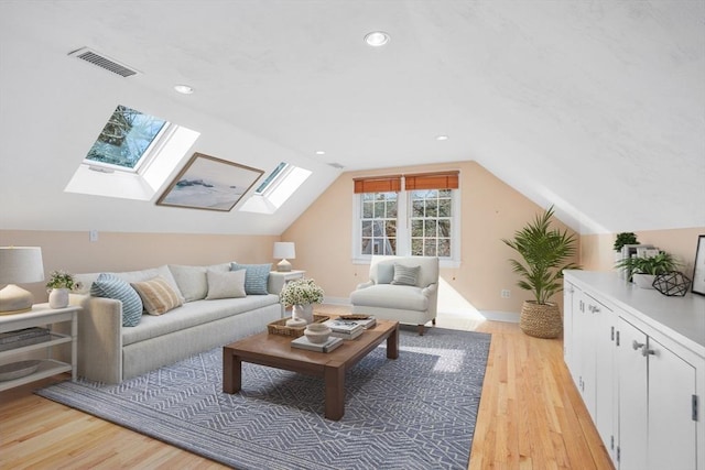 bonus room featuring lofted ceiling, visible vents, light wood finished floors, and recessed lighting