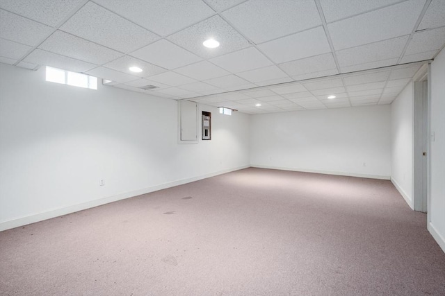 below grade area with carpet, a drop ceiling, baseboards, and recessed lighting