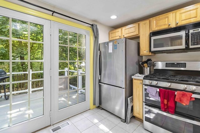69 Powder Mill Rd, Maynard, MA 01754 - kitchen featuring appliances with stainless steel finishes, light tile patterned floors, light brown cabinetry, and recessed lighting