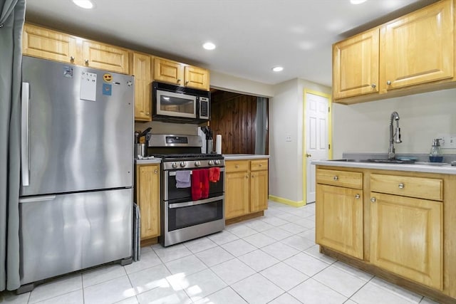 69 Powder Mill Rd, Maynard, MA 01754 - kitchen featuring appliances with stainless steel finishes, recessed lighting, light tile patterned flooring, light countertops, and light brown cabinets