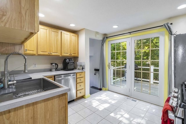 69 Powder Mill Rd, Maynard, MA 01754 - kitchen with appliances with stainless steel finishes, light brown cabinetry, light countertops, light tile patterned flooring, and recessed lighting