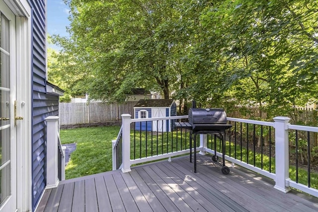69 Powder Mill Rd, Maynard, MA 01754 - deck with a storage unit, a fenced backyard, and a grill