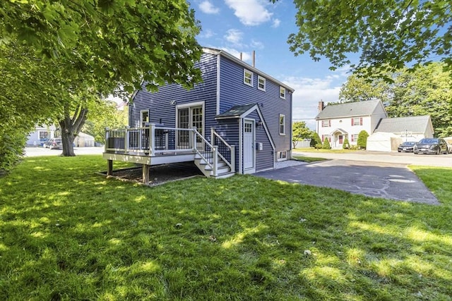69 Powder Mill Rd, Maynard, MA 01754 - back of house with a wooden deck and a yard