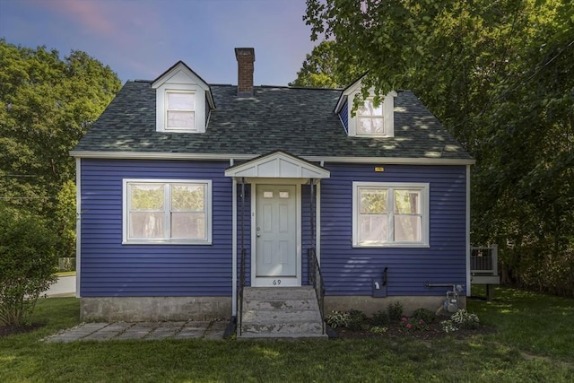 69 Powder Mill Rd, Maynard, MA 01754 - cape cod home with a chimney, a front lawn, and a shingled roof