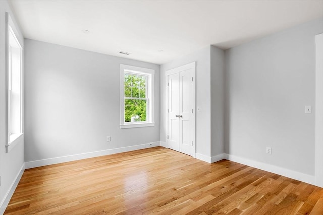 10 Whittier Rd, Natick, MA 01760 - unfurnished bedroom with light wood finished floors and a closet