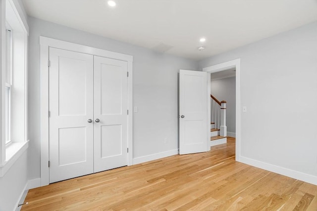 10 Whittier Rd, Natick, MA 01760 - unfurnished bedroom featuring light wood finished floors, recessed lighting, and a closet
