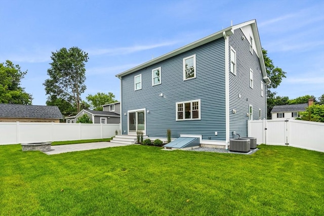 10 Whittier Rd, Natick, MA 01760 - rear view of property featuring a gate, a fenced backyard, and a patio area