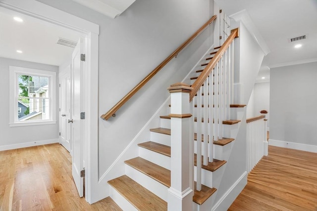 10 Whittier Rd, Natick, MA 01760 - stairs featuring wood finished floors, recessed lighting, and crown molding