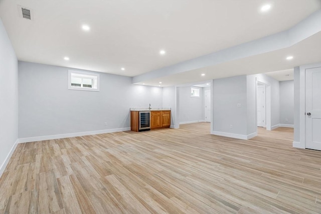 10 Whittier Rd, Natick, MA 01760 - basement with beverage cooler, wet bar, recessed lighting, and light wood finished floors