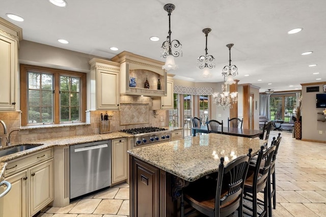 15 Wenlock Cir, Easton, MA 02356 - kitchen with cream cabinets, stainless steel appliances, a chandelier, recessed lighting, and a breakfast bar
