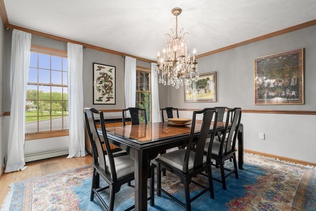 15 Wenlock Cir, Easton, MA 02356 - dining area featuring a baseboard radiator, wood finished floors, a chandelier, ornamental molding, and baseboards