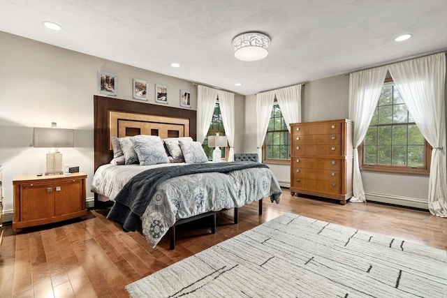 15 Wenlock Cir, Easton, MA 02356 - bedroom featuring multiple windows, light wood-style floors, a baseboard radiator, and recessed lighting