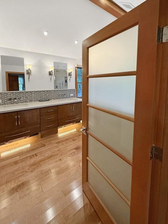 15 Wenlock Cir, Easton, MA 02356 - bathroom featuring hardwood / wood-style floors, double vanity, backsplash, and recessed lighting