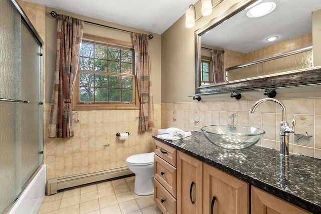 15 Wenlock Cir, Easton, MA 02356 - bathroom featuring a baseboard heating unit, vanity, tile walls, toilet, and combined bath / shower with glass door
