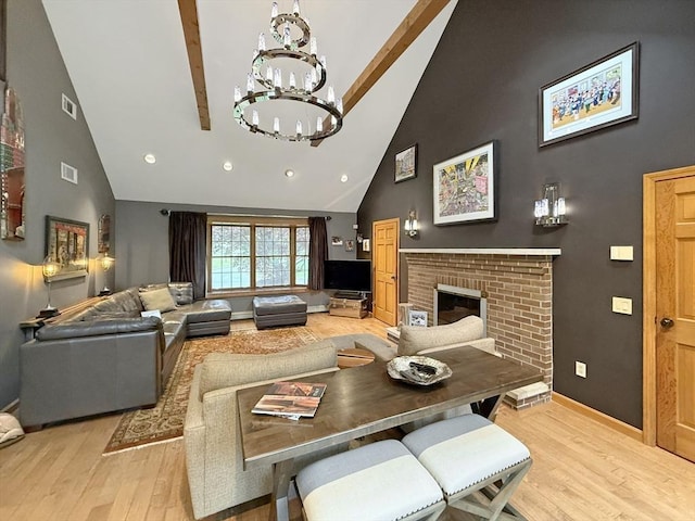 15 Wenlock Cir, Easton, MA 02356 - living area with high vaulted ceiling, light wood-style floors, a chandelier, beamed ceiling, and baseboards