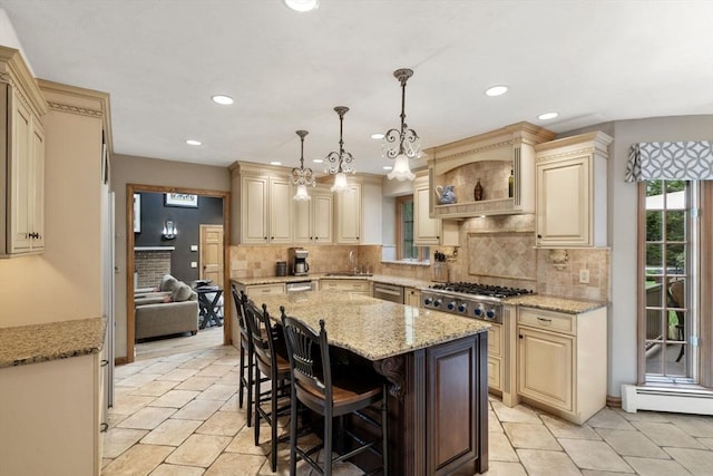 15 Wenlock Cir, Easton, MA 02356 - kitchen featuring cream cabinets, appliances with stainless steel finishes, a kitchen island, light stone countertops, and recessed lighting