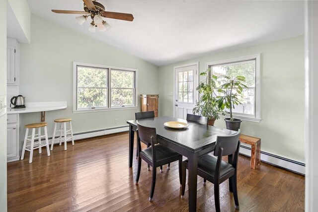 58 Edward Rd, Watertown, MA 02472 - dining area with a baseboard heating unit, lofted ceiling, ceiling fan, and dark wood-style floors