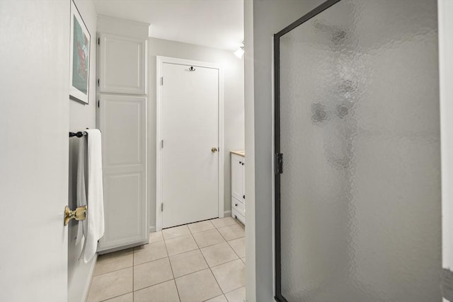 58 Edward Rd, Watertown, MA 02472 - bathroom featuring a shower stall, tile patterned flooring, and vanity
