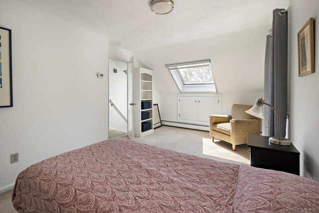 58 Edward Rd, Watertown, MA 02472 - carpeted bedroom with a baseboard radiator, lofted ceiling, and a skylight