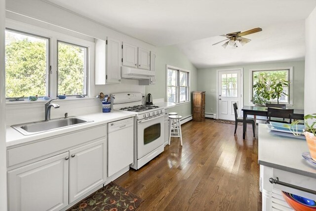 58 Edward Rd, Watertown, MA 02472 - kitchen with white appliances, a sink, under cabinet range hood, ceiling fan, and a baseboard radiator