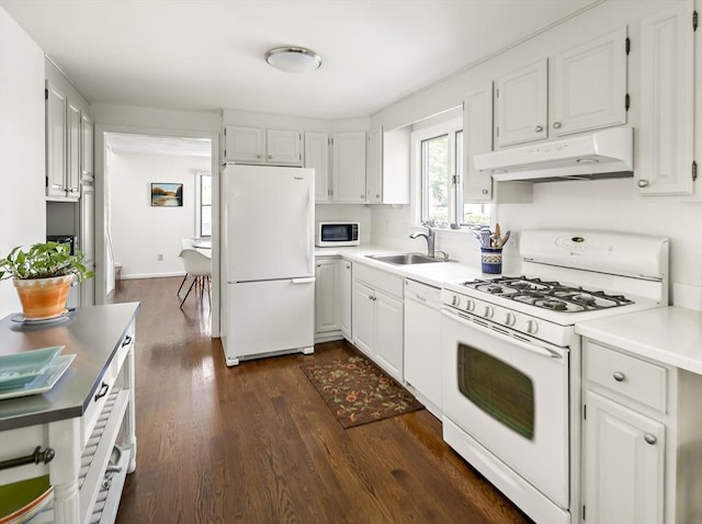 58 Edward Rd, Watertown, MA 02472 - kitchen featuring white appliances, under cabinet range hood, a sink, dark wood-type flooring, and white cabinets