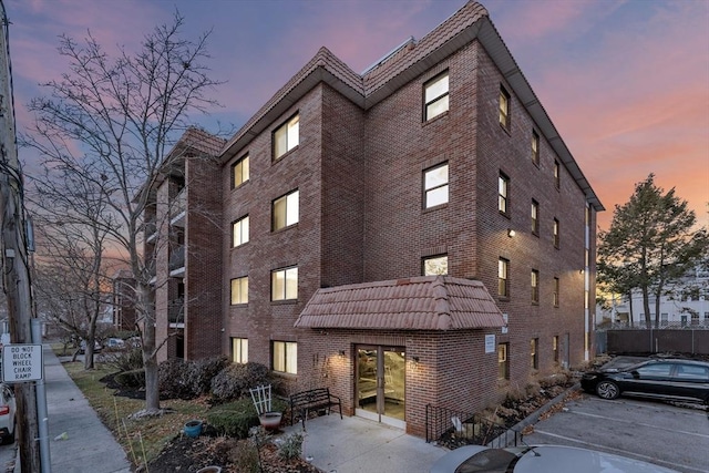 view of outdoor building at dusk