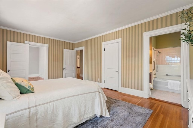 bedroom with baseboards, ornamental molding, wood finished floors, and wallpapered walls