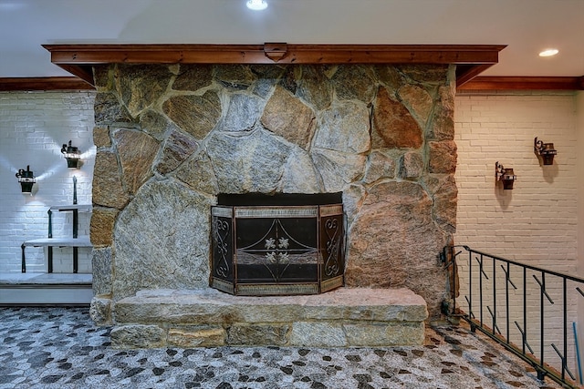 room details featuring ornamental molding and a fireplace