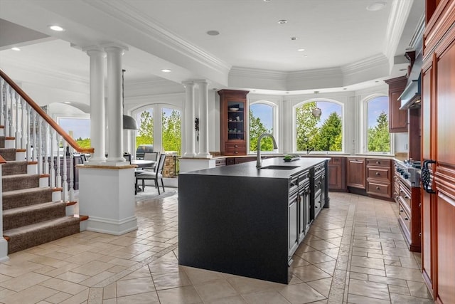 6 Wayside Cir, Framingham, MA 01701 - kitchen with a sink, decorative columns, ornamental molding, an island with sink, and stainless steel gas stovetop