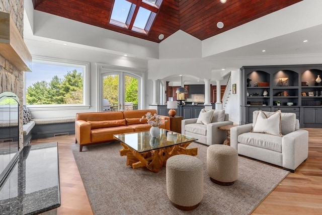 6 Wayside Cir, Framingham, MA 01701 - living room featuring ornate columns, arched walkways, wooden ceiling, recessed lighting, and light wood-style floors