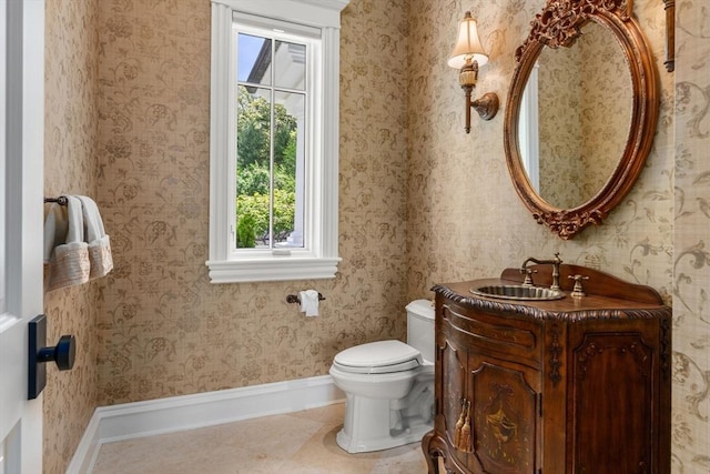 6 Wayside Cir, Framingham, MA 01701 - half bath featuring baseboards, toilet, vanity, and tile patterned floors