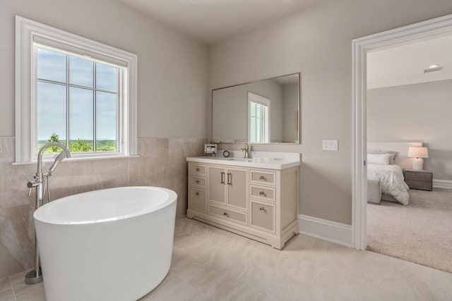 6 Wayside Cir, Framingham, MA 01701 - bathroom featuring healthy amount of natural light, vanity, a freestanding tub, ensuite bathroom, and tile walls