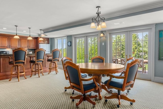 6 Wayside Cir, Framingham, MA 01701 - dining room featuring french doors, light carpet, crown molding, and baseboards