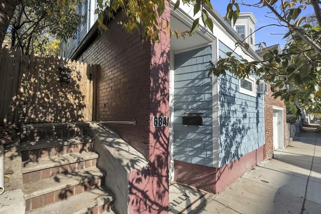 view of property exterior with fence