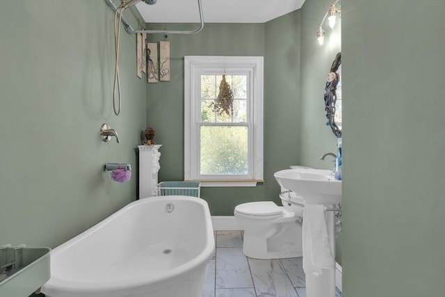 full bathroom with a soaking tub, walk in shower, marble finish floor, and plenty of natural light