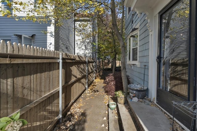 view of side of property with fence