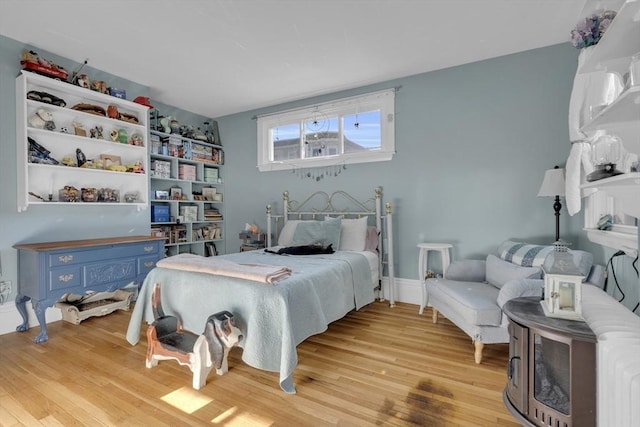 bedroom featuring light wood-style flooring