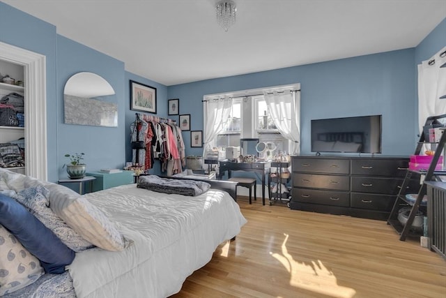 bedroom with light wood finished floors