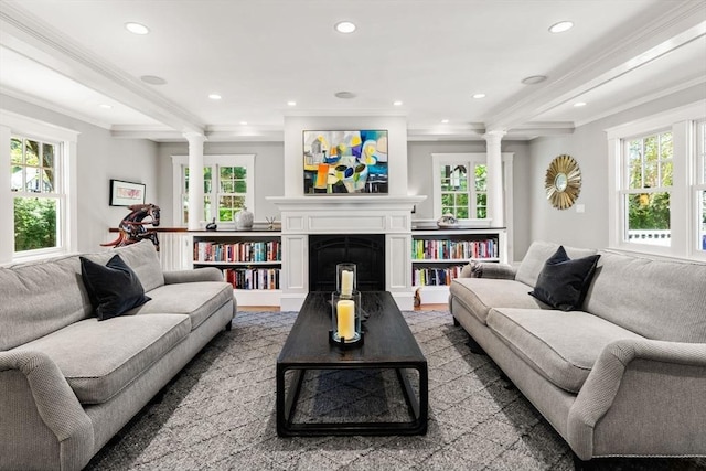living room with recessed lighting, decorative columns, and plenty of natural light