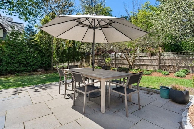 view of patio / terrace featuring fence and outdoor dining space