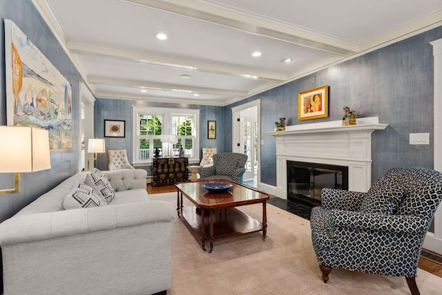 living room with ornamental molding, beam ceiling, recessed lighting, a fireplace with flush hearth, and light wood-style flooring