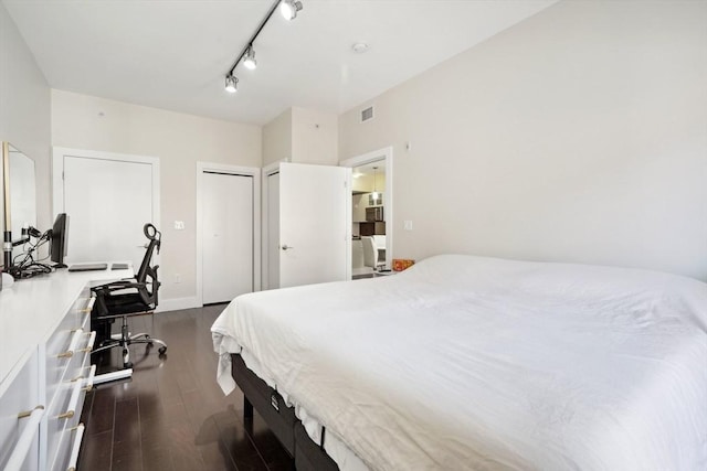 bedroom featuring dark wood-type flooring