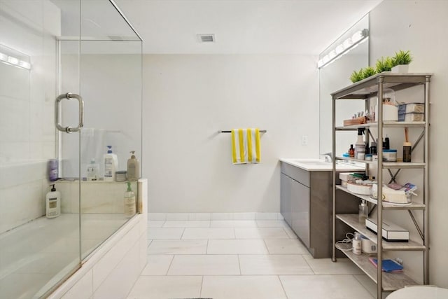 bathroom featuring shower / bath combination with glass door, vanity, and tile patterned floors