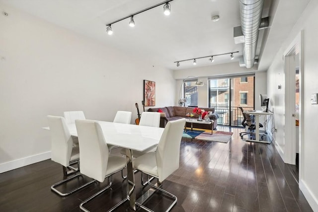 dining area with dark hardwood / wood-style flooring