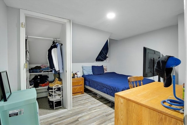 bedroom with wood finished floors